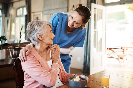 What is assisted living? Nurse caring for a woman.